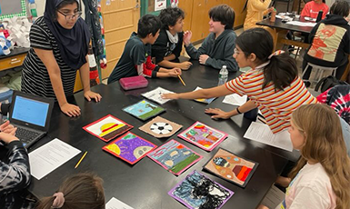  students looking at artwork